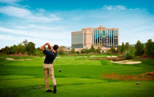 a picture of a person golfing on a golf course